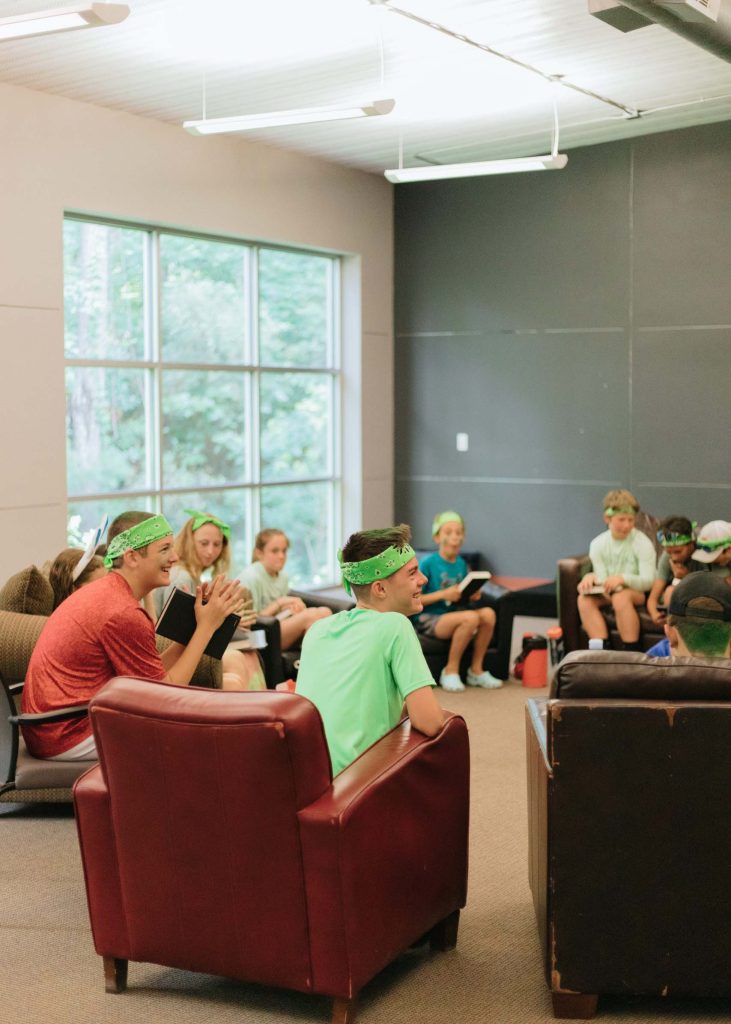 StoneBridge summer interns meeting with kids at the student building.